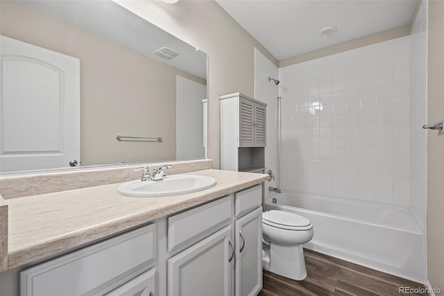 13870 Ash Cir, Brighton, CO 80602 - bathroom with vanity, wood finished floors, and shower / washtub combination