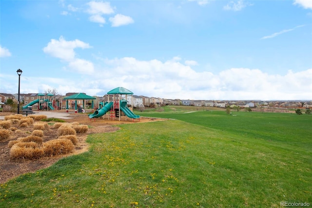 13870 Ash Cir, Brighton, CO 80602 - community jungle gym with a lawn