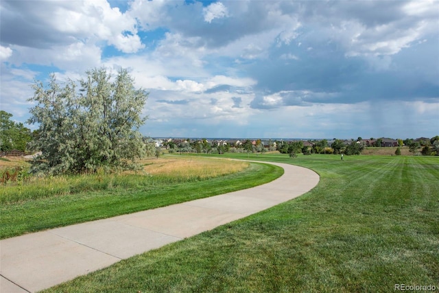 13870 Ash Cir, Brighton, CO 80602 - view of home's community with a lawn
