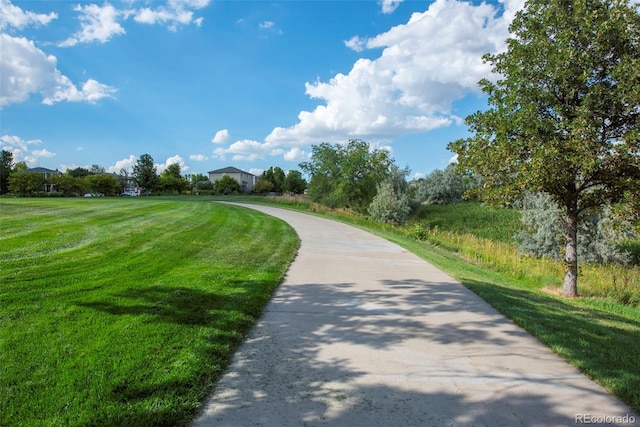 13870 Ash Cir, Brighton, CO 80602 - view of home's community with a lawn