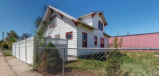 view of property exterior with fence