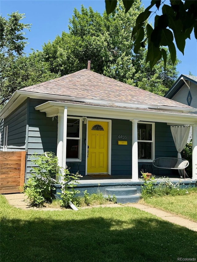 4455 Wolff St, Denver, CO 80212 - view of front of property with a shingled roof and a porch
