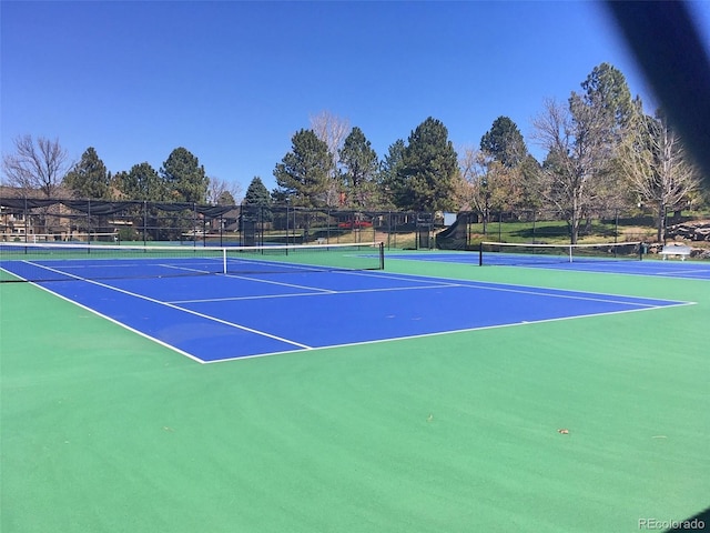 view of sport court with basketball hoop