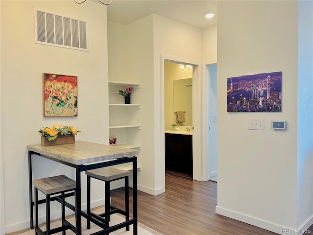 dining room with dark hardwood / wood-style flooring