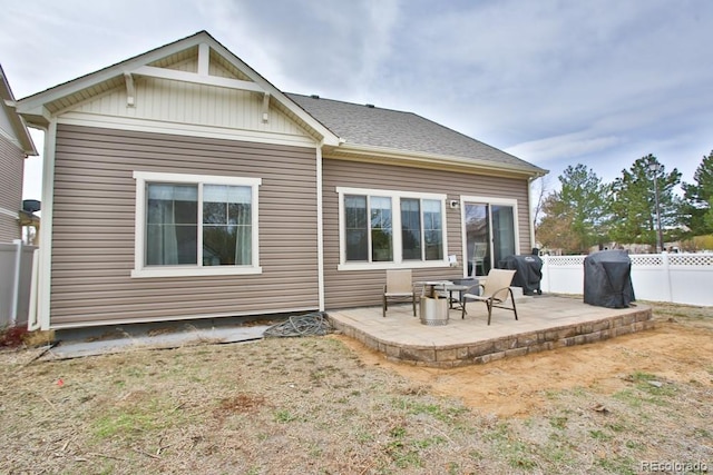 18709 E 47th Dr, Denver, CO 80249 - rear view of property featuring fence and a patio area