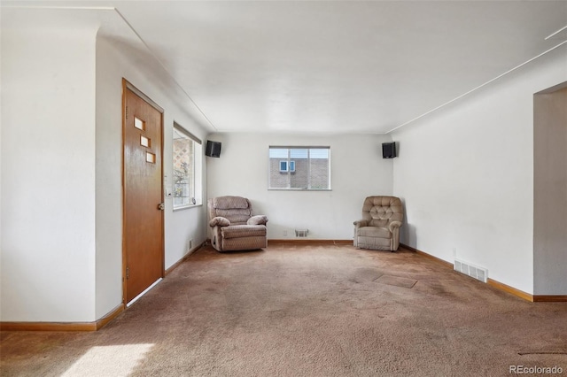 unfurnished room featuring carpet