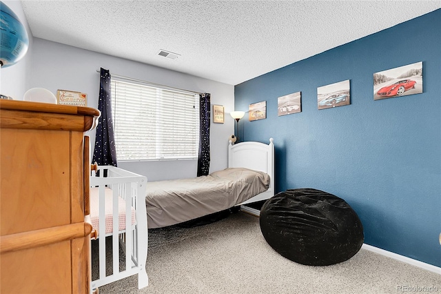 14944 E Archer Cir, Aurora, CO 80012 - carpeted bedroom with baseboards and a textured ceiling