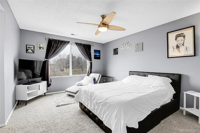 14944 E Archer Cir, Aurora, CO 80012 - bedroom with carpet, baseboards, a textured ceiling, and a ceiling fan