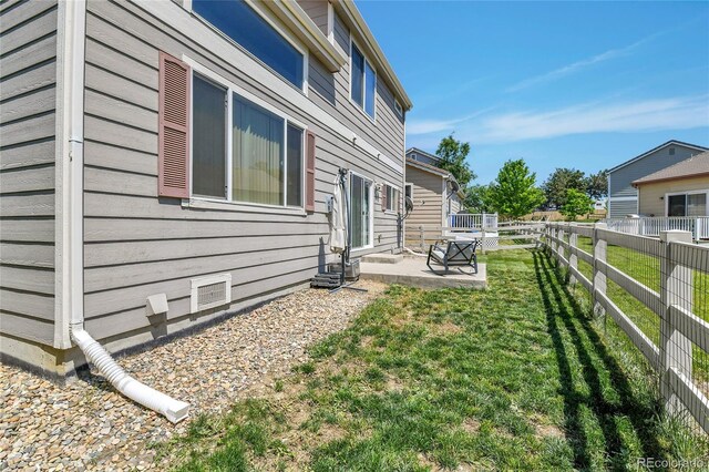 14944 E Archer Cir, Aurora, CO 80012 - view of home's exterior with a patio area