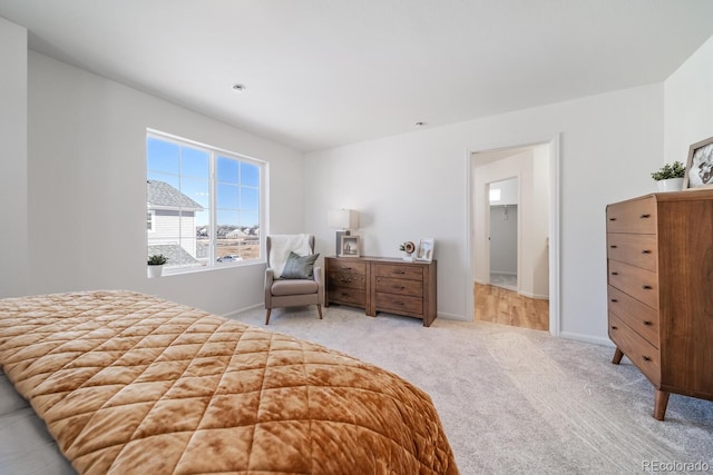 carpeted bedroom with baseboards