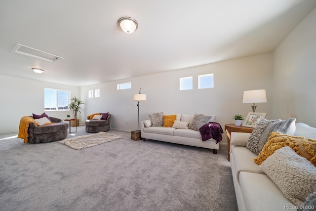 living room with plenty of natural light and carpet