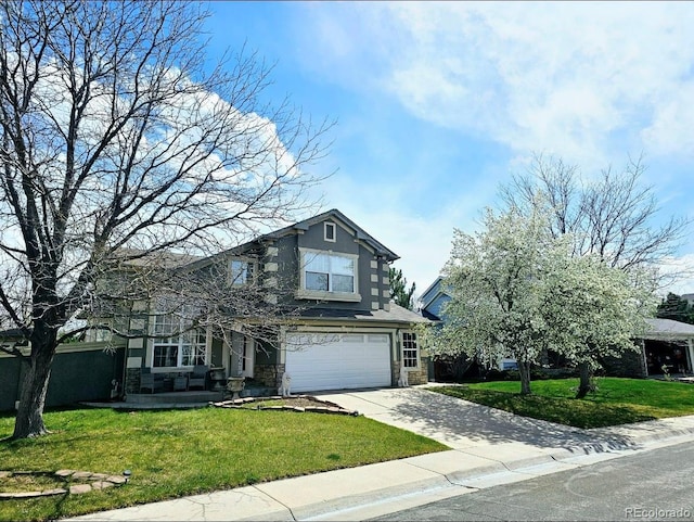 traditional-style house featuring an attached garage, stone siding, fence, a front lawn, and driveway