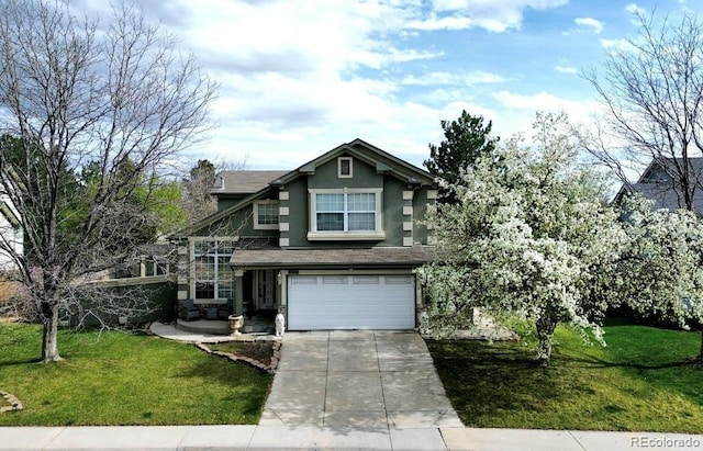 craftsman inspired home featuring a garage, a front yard, driveway, and stucco siding