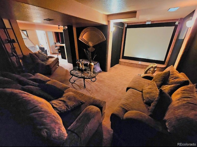 carpeted cinema room featuring visible vents