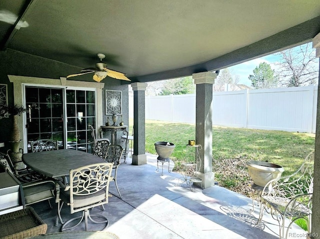 view of patio featuring a fenced backyard, ceiling fan, and outdoor dining area