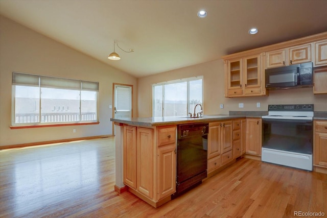 kitchen featuring black appliances, light hardwood / wood-style floors, lofted ceiling, and sink