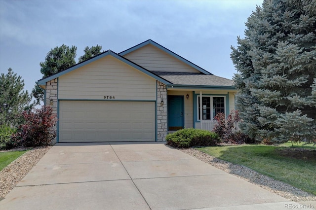 ranch-style house featuring a garage, stone siding, roof with shingles, and concrete driveway