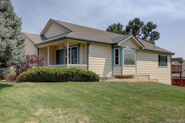 exterior space featuring a shingled roof and a front yard