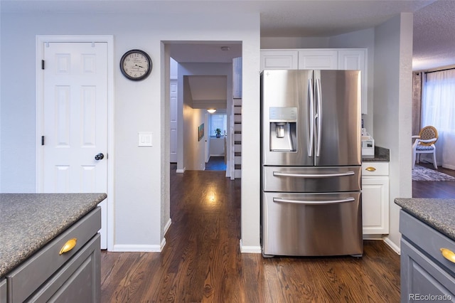 kitchen with gray cabinetry, stainless steel fridge with ice dispenser, and white cabinets