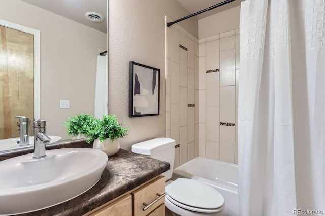 full bathroom with toilet, shower / bath combo with shower curtain, and vanity