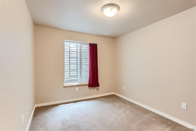 unfurnished room featuring carpet flooring