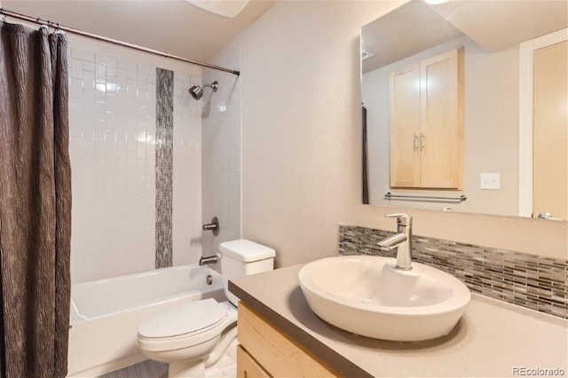 full bathroom featuring backsplash, vanity, toilet, and shower / tub combo