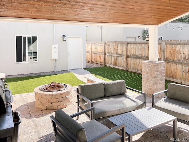 view of patio / terrace featuring an outdoor living space with a fire pit