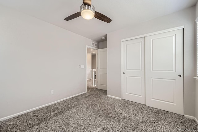 unfurnished bedroom with a ceiling fan, a closet, carpet, baseboards, and visible vents