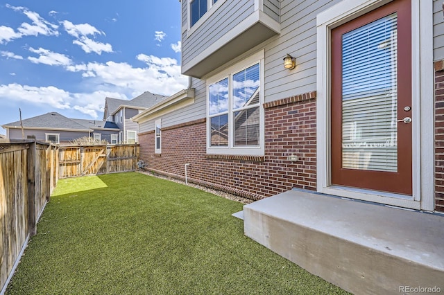 view of yard featuring a fenced backyard