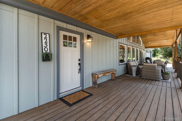 2230 S Platte River Rd, Sedalia, CO 80135 - view of exterior entry featuring board and batten siding and covered porch