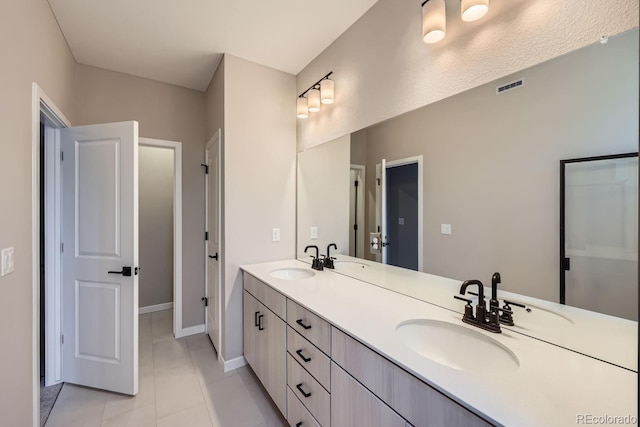 9627 Browns Peak Cir, Littleton, CO 80125 - bathroom with double vanity and tile patterned floors