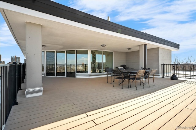 wooden deck with outdoor dining space