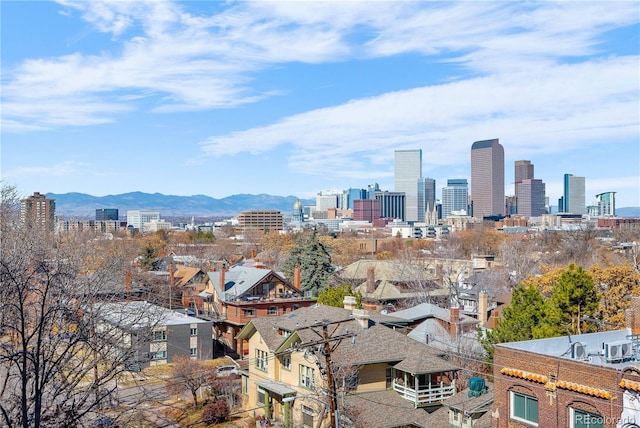 property's view of city featuring a mountain view