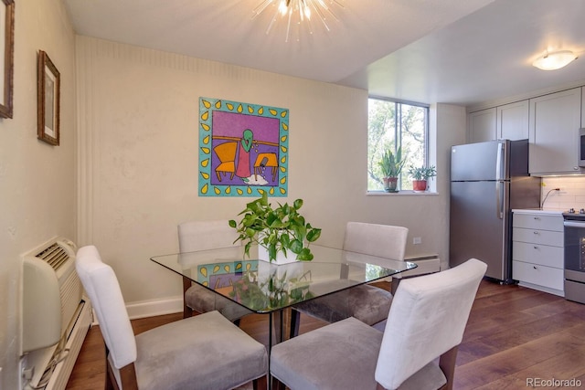 1085 N Lafayette St Unit 704, Denver, CO 80218 - dining space featuring dark wood-style flooring, a baseboard radiator, and baseboards