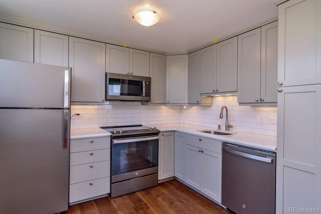 1085 N Lafayette St Unit 704, Denver, CO 80218 - kitchen with stainless steel appliances, a sink, light countertops, and backsplash