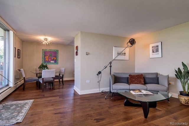 1085 N Lafayette St Unit 704, Denver, CO 80218 - living room featuring wood finished floors, baseboards, and a wall unit AC