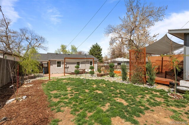 view of yard with a wooden deck