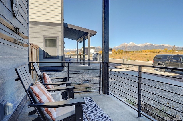 balcony featuring a mountain view