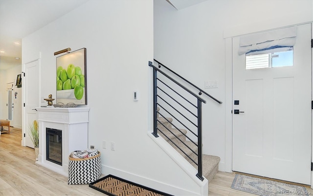 entryway with light hardwood / wood-style floors