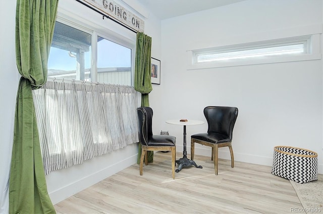 sitting room featuring light hardwood / wood-style floors