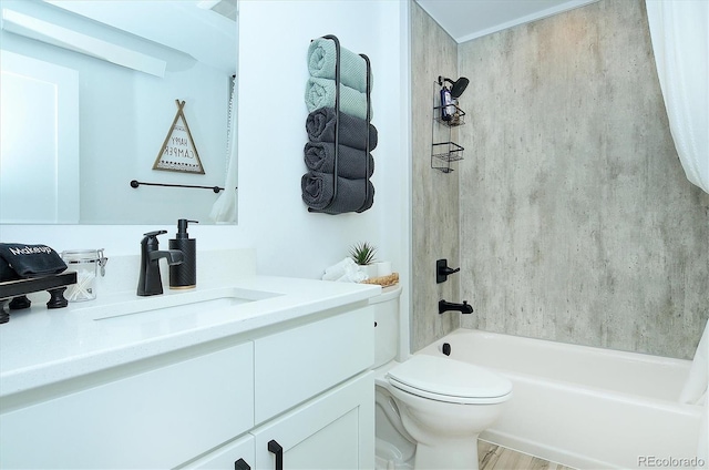 full bathroom featuring vanity, tiled shower / bath combo, and toilet