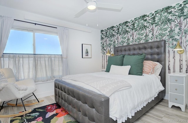 bedroom featuring hardwood / wood-style flooring and ceiling fan