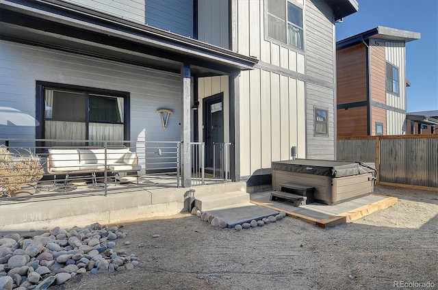 entrance to property featuring a hot tub