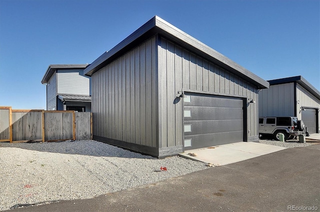 exterior space featuring an outbuilding and a garage