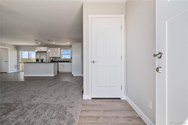 unfurnished living room with light wood-type flooring