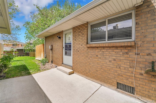 7902 Meade St Unit A10, Westminster, CO 80030 - entrance to property featuring brick siding and a patio