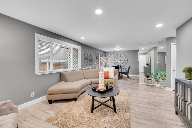 7902 Meade St Unit A10, Westminster, CO 80030 - living room featuring baseboards, recessed lighting, and light wood-type flooring