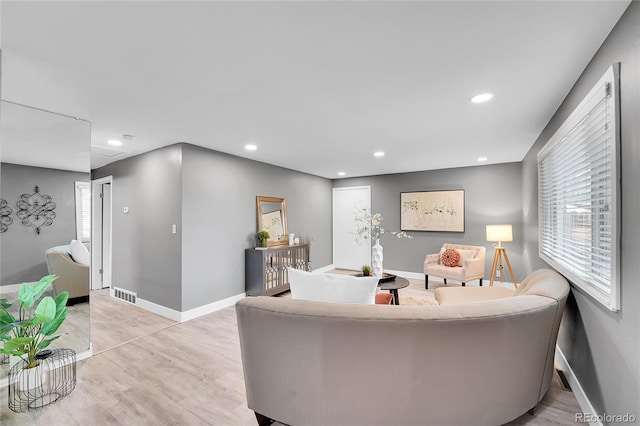 7902 Meade St Unit A10, Westminster, CO 80030 - living area featuring baseboards, light wood-type flooring, recessed lighting, and plenty of natural light
