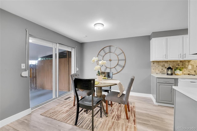 7902 Meade St Unit A10, Westminster, CO 80030 - dining area featuring light wood-type flooring and baseboards