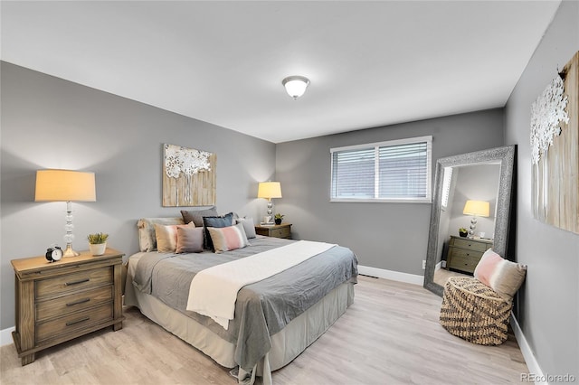 7902 Meade St Unit A10, Westminster, CO 80030 - bedroom featuring light wood-style flooring and baseboards